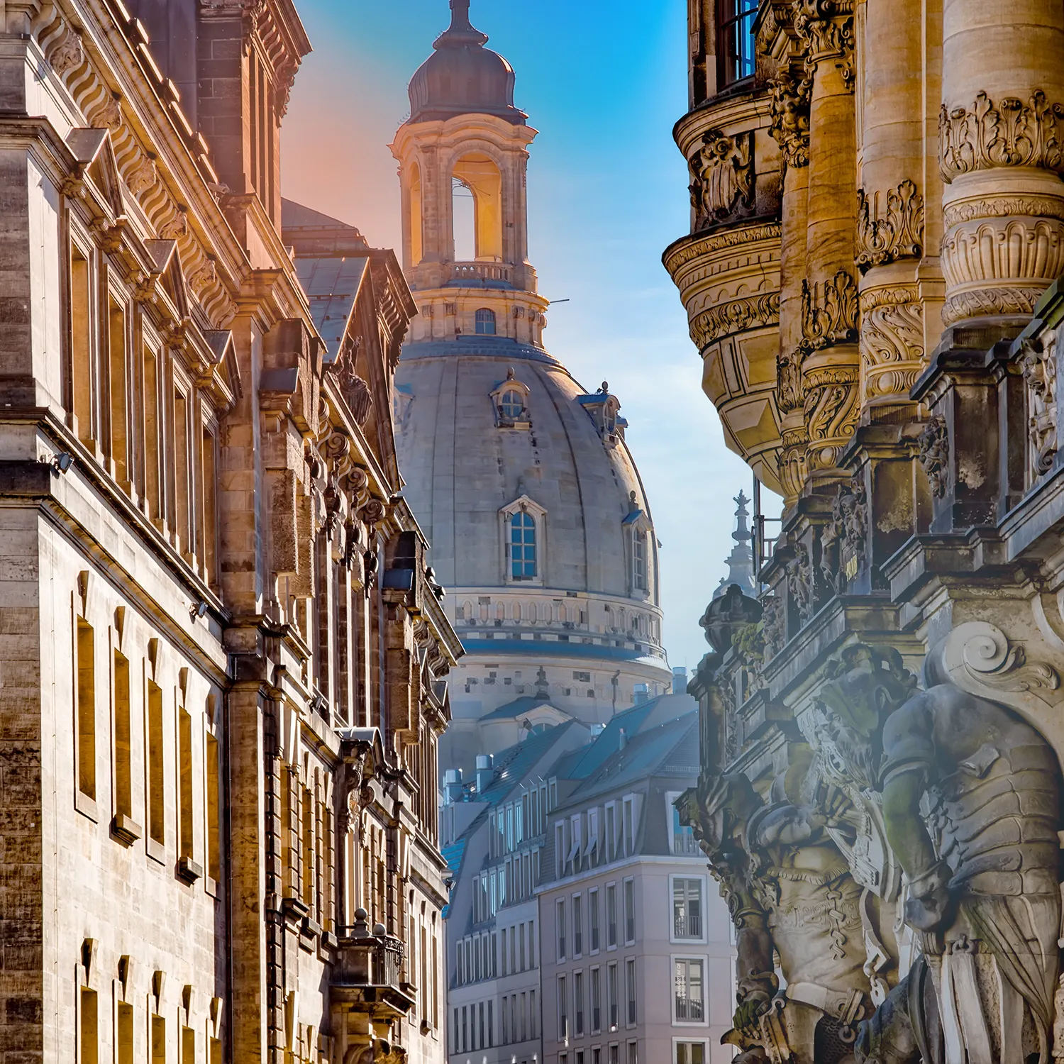 The dome of the Frauenkirche in Dresden between historic facades.