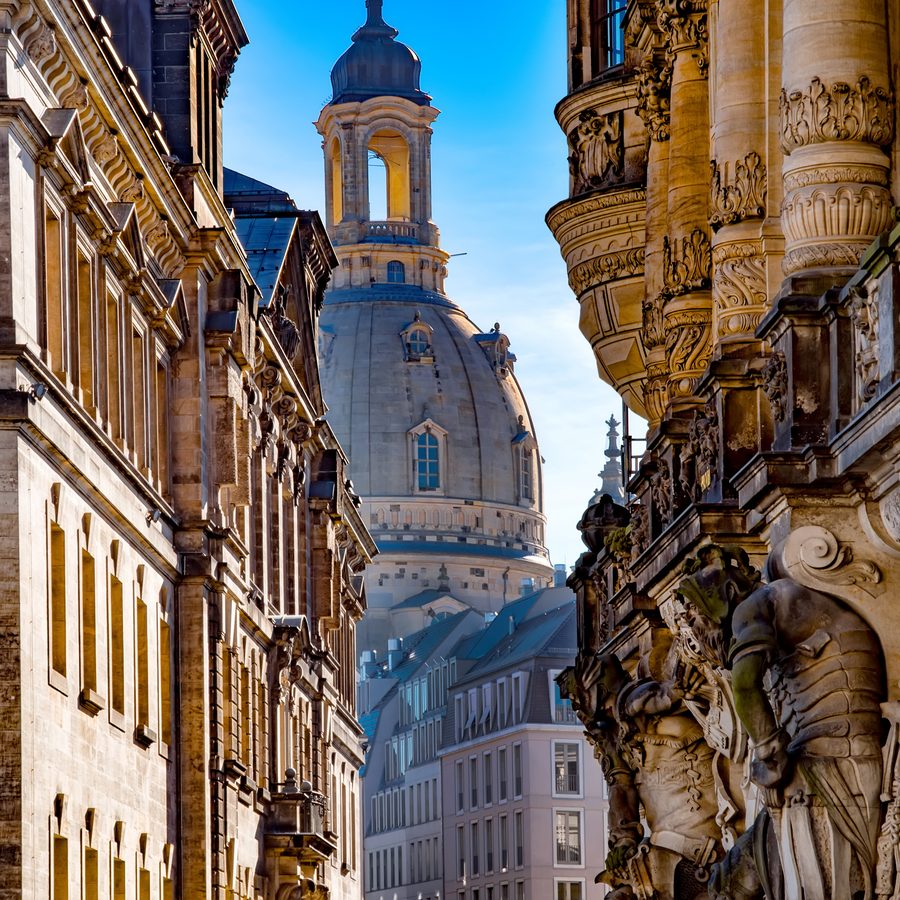 The dome of the Frauenkirche in Dresden between historic facades.